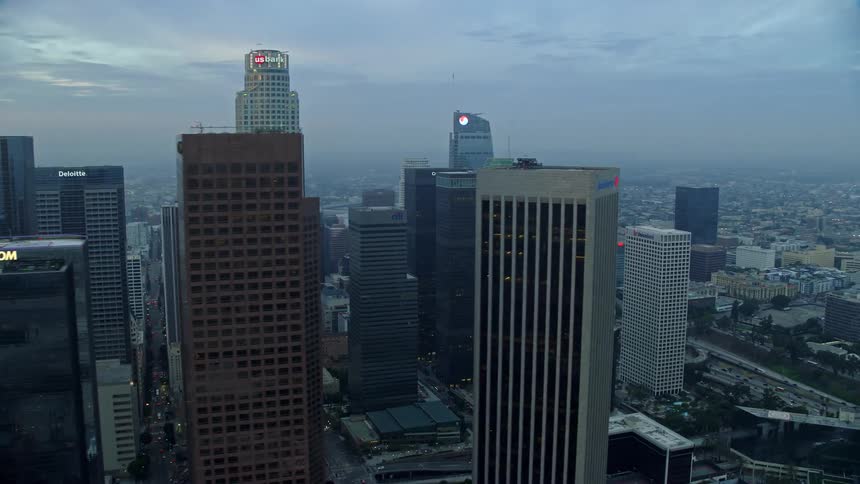 Aerial view of the US Bank Tower and other skyscrapers in Downtown Los Angeles during sunrise on a cloudy winter morning