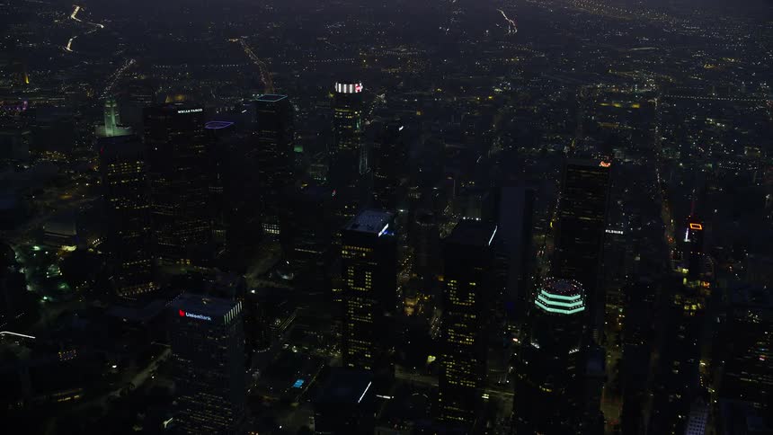 Aerial footage of Downtown Los Angeles skyscrapers at sunrise