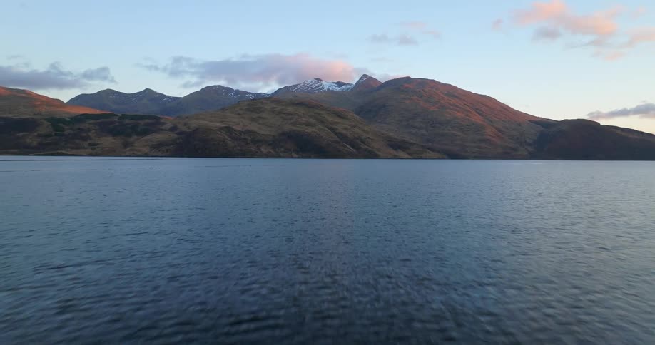 Coastal mountains with snow on top at sunrise