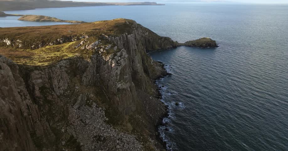 An aerial view of a rocky cliff on a coastline