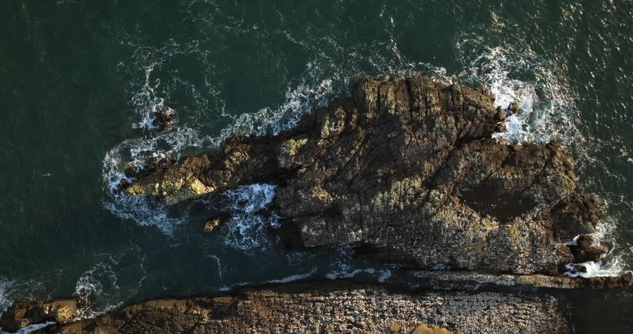 A birds eye view of a rocky shoreline in nature