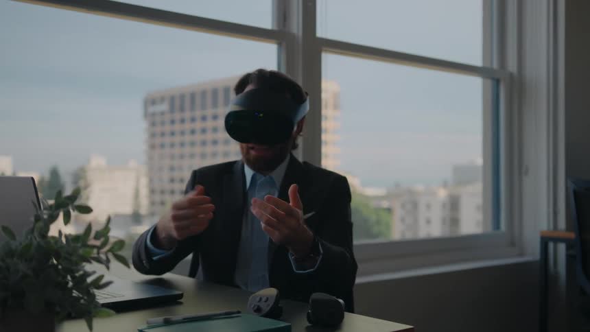 A man wears a virtual reality headset during a video call