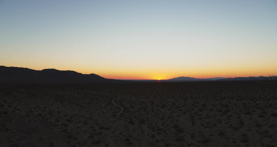 A view of the desert at sunset