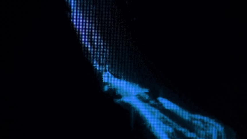 A smudged blue mark appears on a black screen