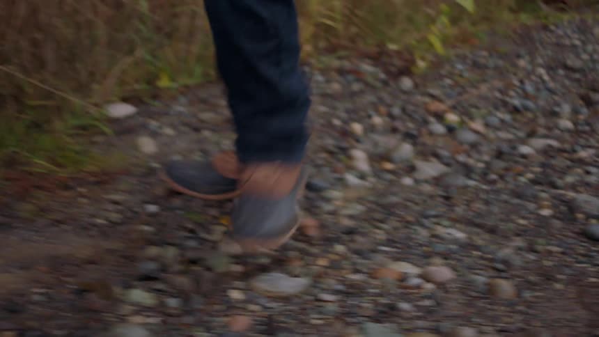 A person is hiking through the wilderness alone