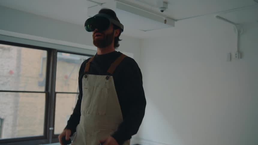 A man is using a virtual reality headset