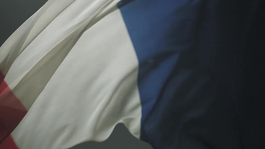 A flag waves and billows