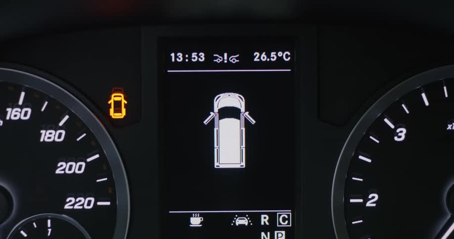 Close up of car dashboard with symbols and displays