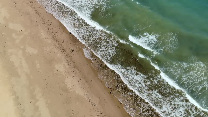 Waves crash against the shore