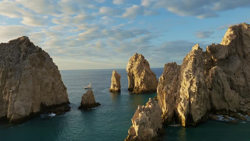Sea stacks sit in a cluster in the ocean