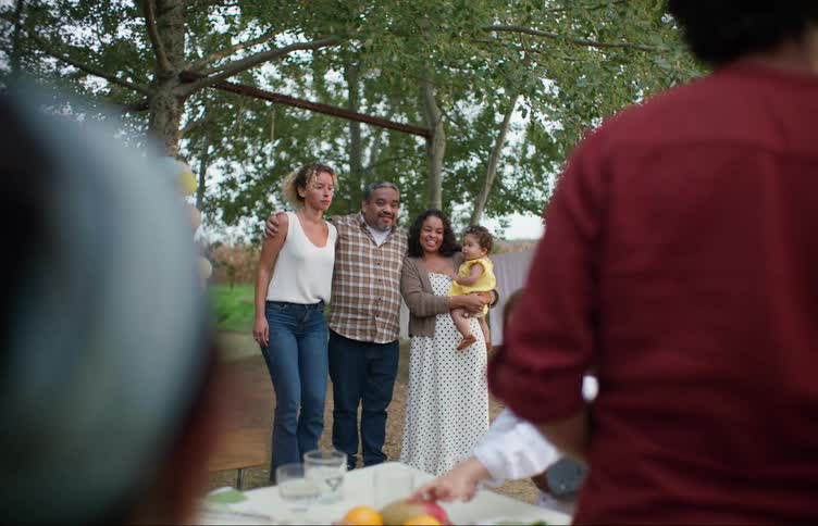 A family is outside and having a party