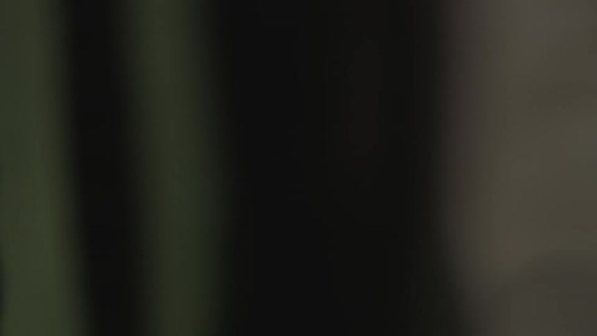A blurry image of flipping through pieces of paper