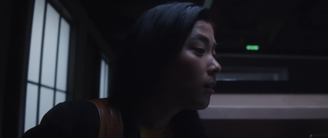 An up close of a woman talking and nodding her head slightly
