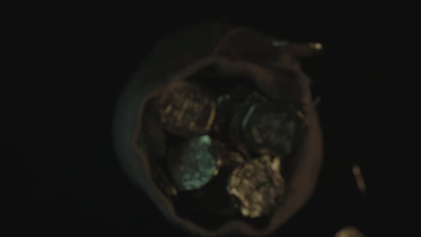 A bag full of gold coins is dropped