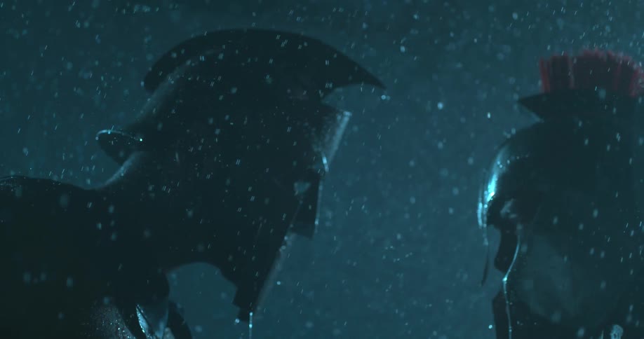 Rain falls on a man in metal armor