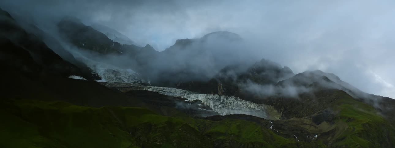 Aerial view of clouds covering the mountains are displayed