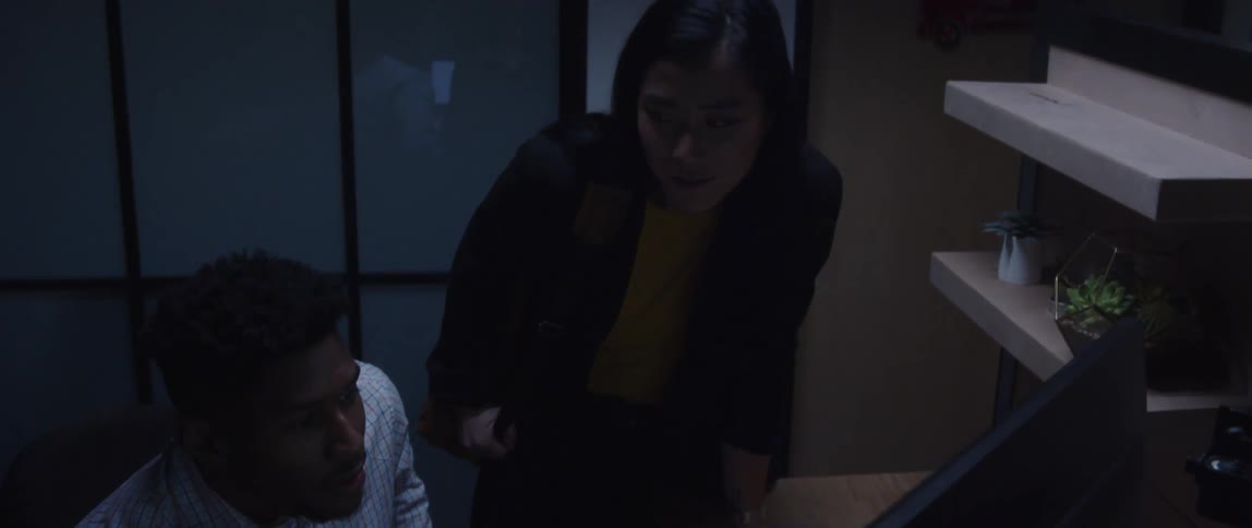 A woman and man working late