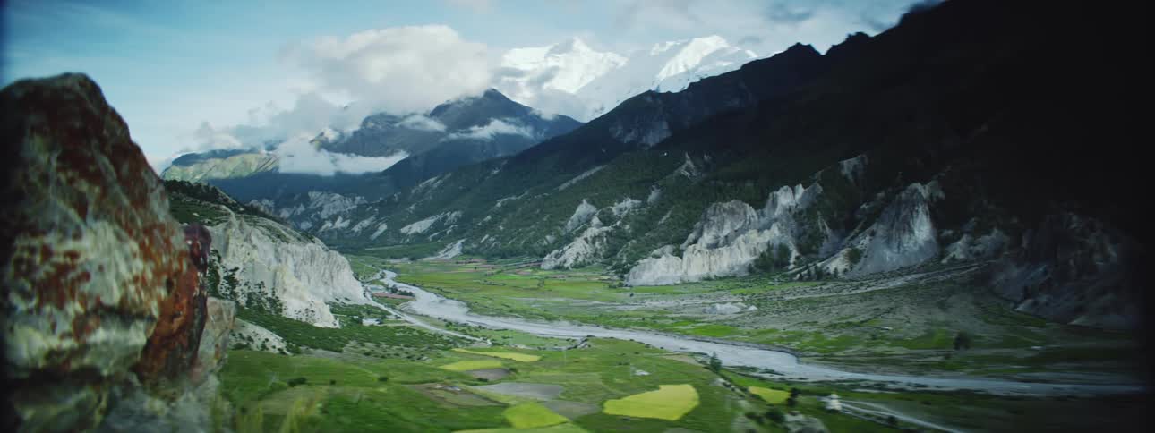 A river runs between the mountains