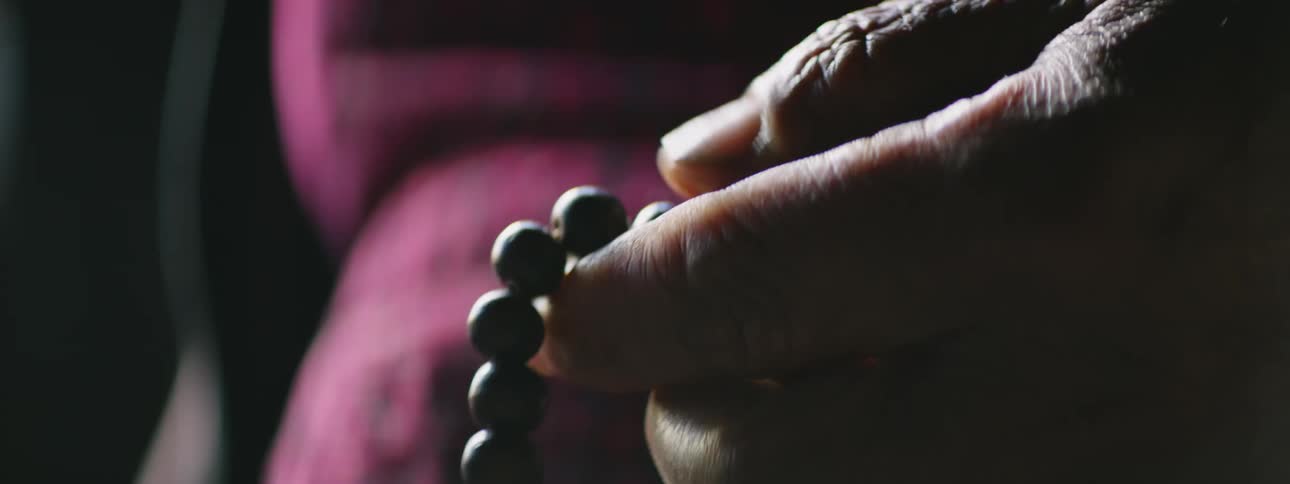Finger Counting Hand Rosary Beads: Close-up Shot