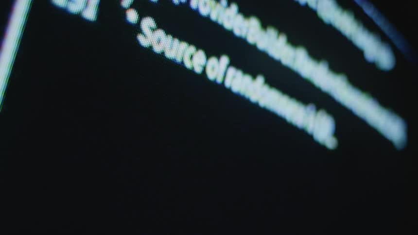 An up close of white text on a computer screen displaying across the screen and down the screen