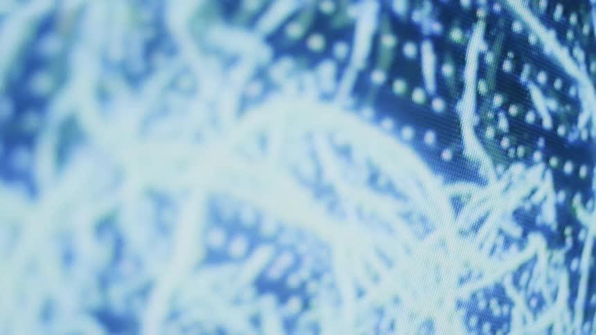 An up close of a television screen with white lines and pixels on it