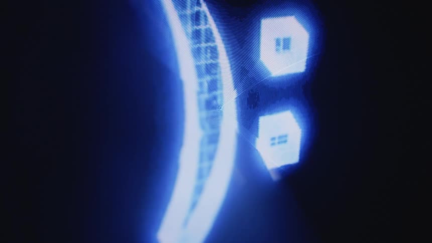 A blue digital animation displayed on a screen