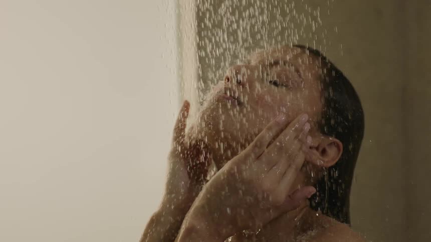 A woman is taking a shower