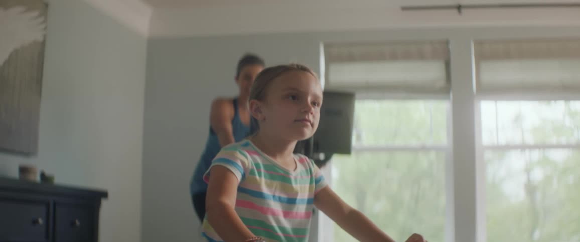 Mother and daughter doing exercise indoors