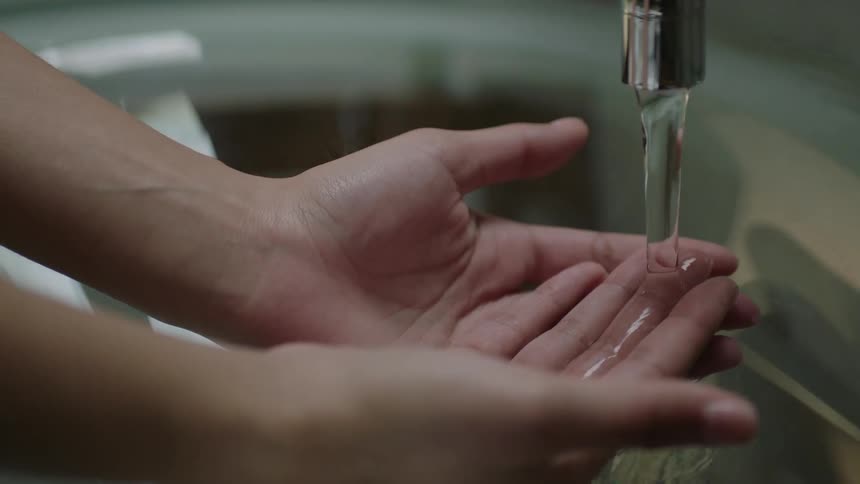 A person is washing their hands