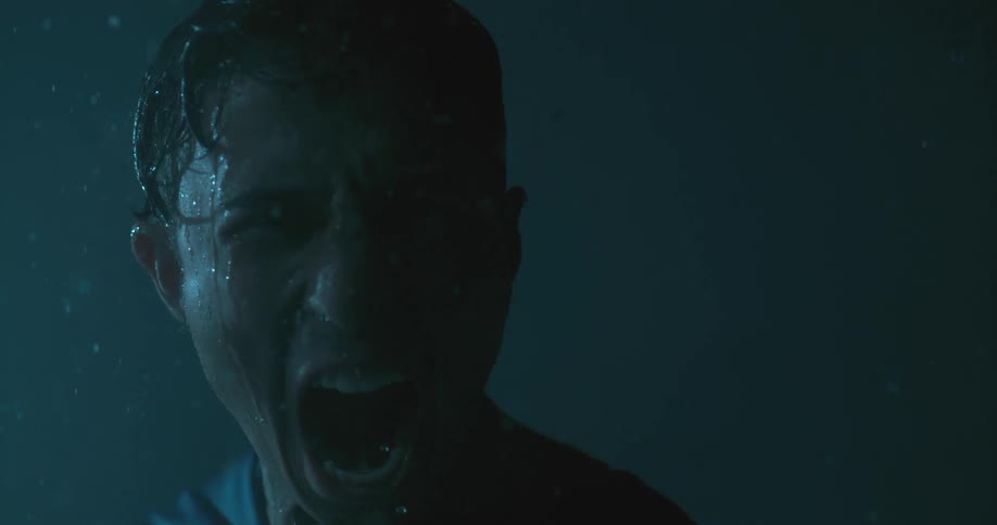 A man stands in the rain