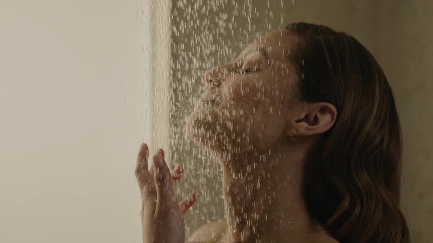 A woman takes a shower