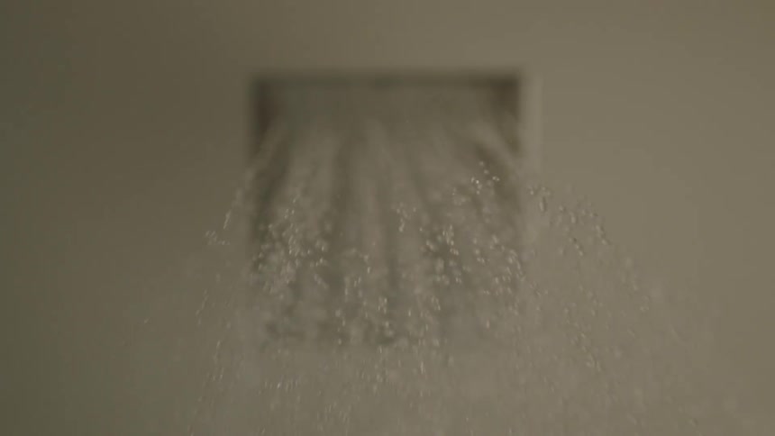 Water pours from a shower head