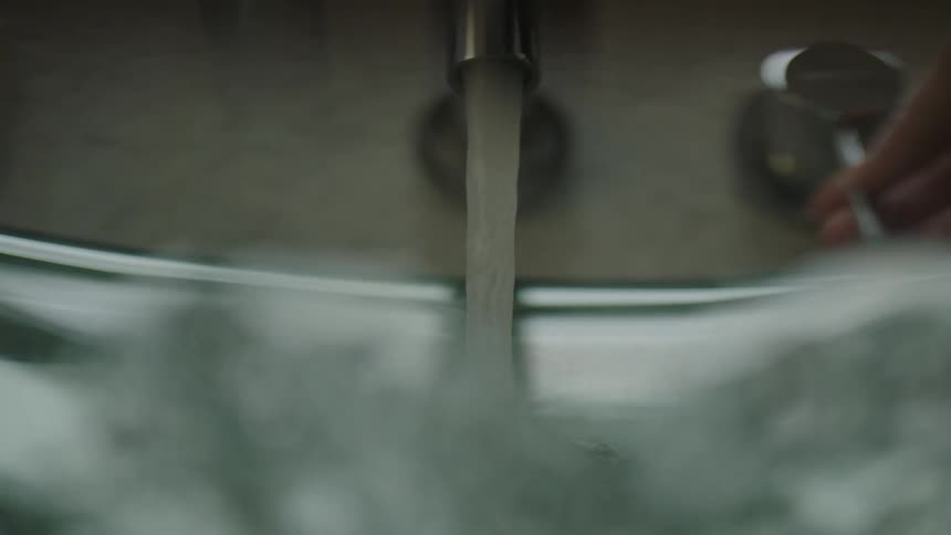 Water coming from a bathroom sink faucet