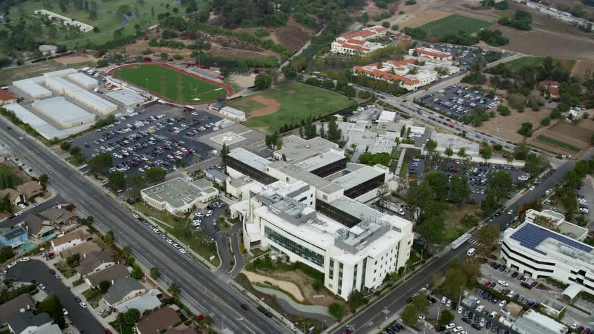 Aerial footage of Providence Holy Cross Medical Center in Mission Hills California on an overcast day