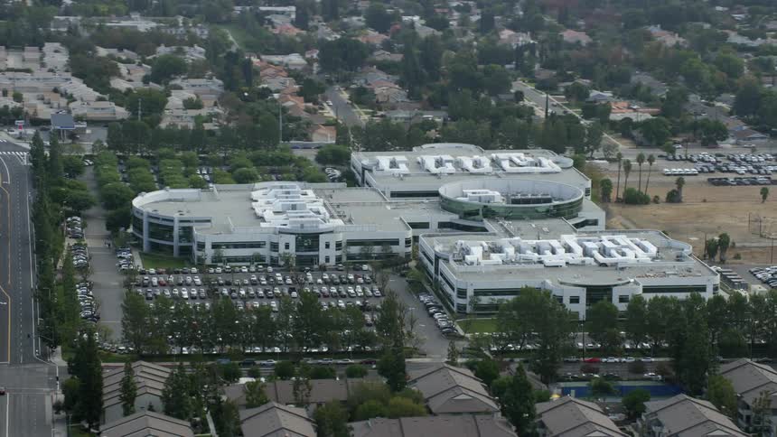 An aerial view of the Medtronic office building in Northridge California on an overcast day during spring or summer shot with a Shotover F1 and Epic Helium camera
