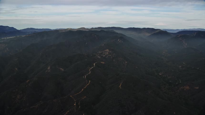 Approaching the Santa Monica Mountains on a hazy day with marine layer in California during summer