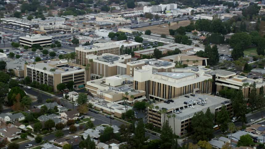 Aerial orbit around Northridge Hospital in Northridge California on an overcast day in the San Fernando Valley