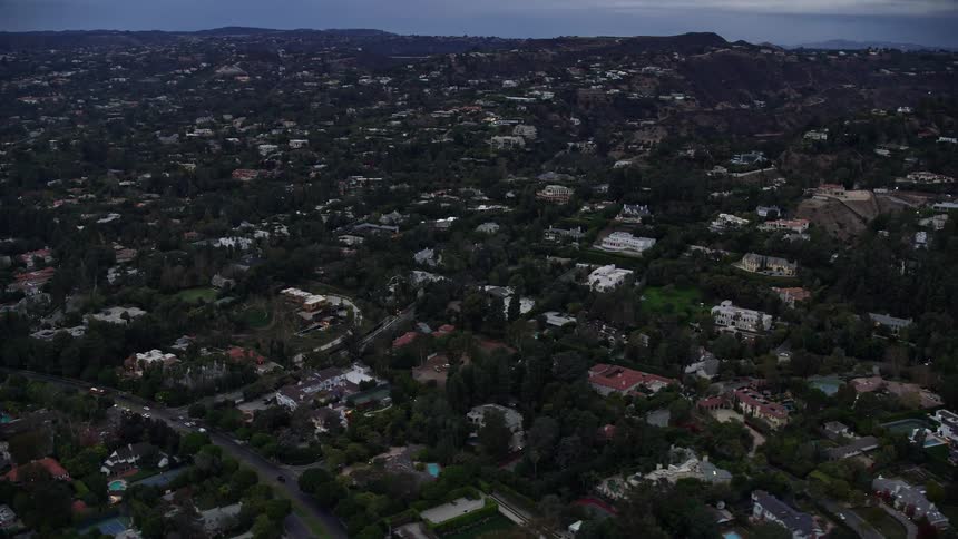 Aerial view of luxurious homes and mansions in Beverly Hills California at twilight