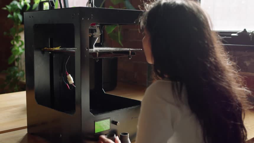 A lady diligently working to repair an equipment displaying her technical skills and dedication to her work