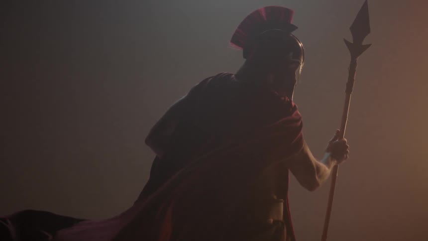 The cloak of a warrior billows around him