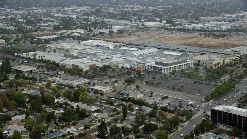 Aerial orbit of Westfield Topanga Mall in Woodland Hills California on a cloudy day