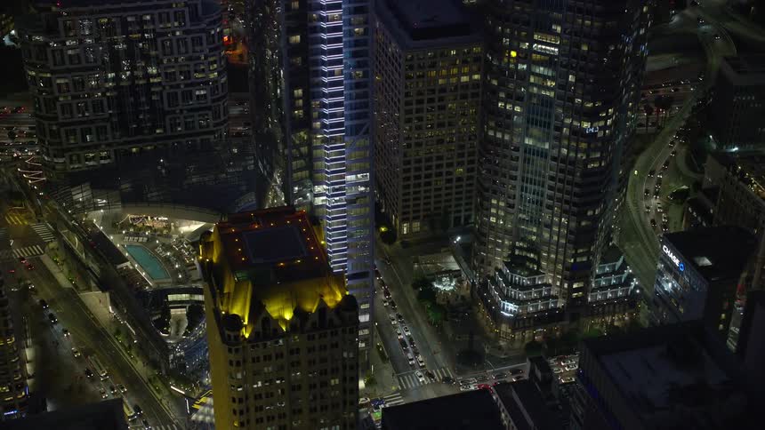 Aerial footage displaying the base of the Wilshire Grand Center in Downtown Los Angeles California at night