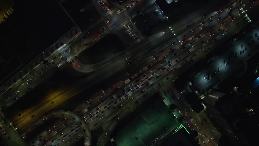 Watch heavy nighttime traffic on the 110 Freeway in downtown Los Angeles from a birds eye view