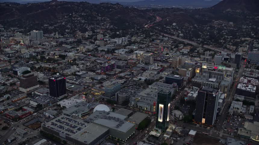 Aerial view at twilight of businesses and office buildings along Sunset Boulevard a famous landmark in Hollywood California