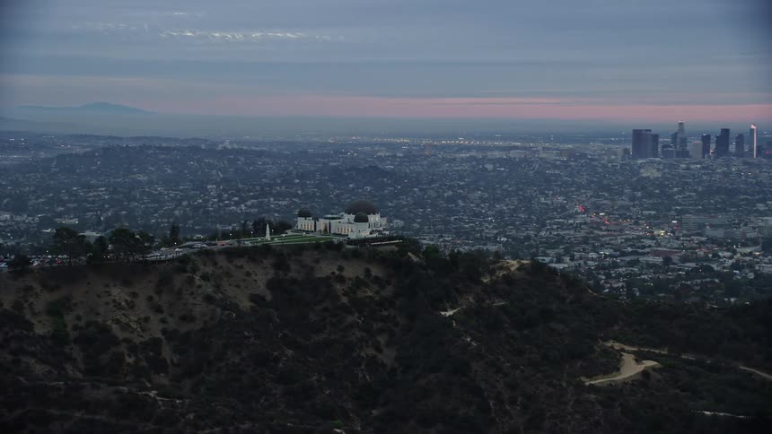 An epic shot of Griffith Observatory and the Los Angeles skyline during twilight captured from above with a Shotover F1 camera