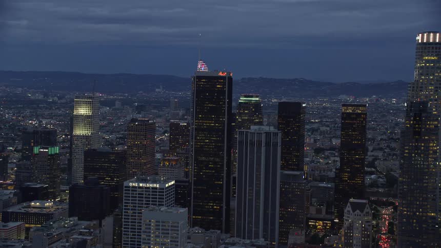 A stunning aerial view of the Wilshire Grand Center and surrounding skyscrapers at twilight in downtown Los Angeles California