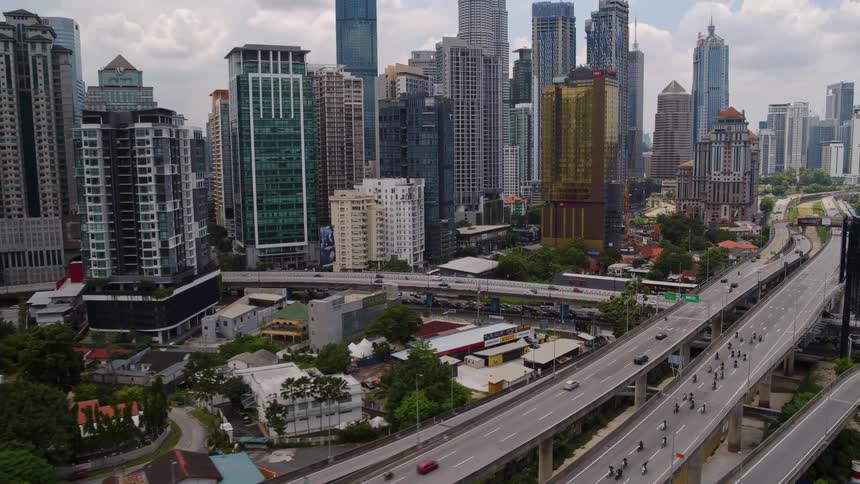 Aerial view of highway and skyscrapers in the city