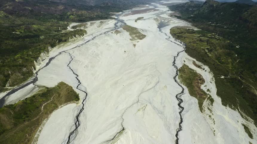 A pair of crooked rivers carve their way along an expansive landscape
