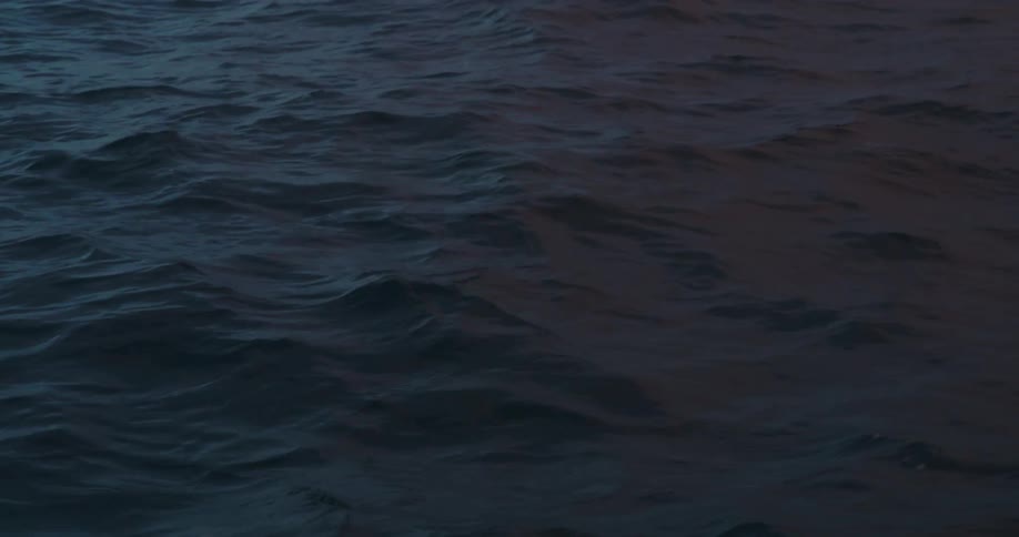 A view of waves in the ocean water is displayed