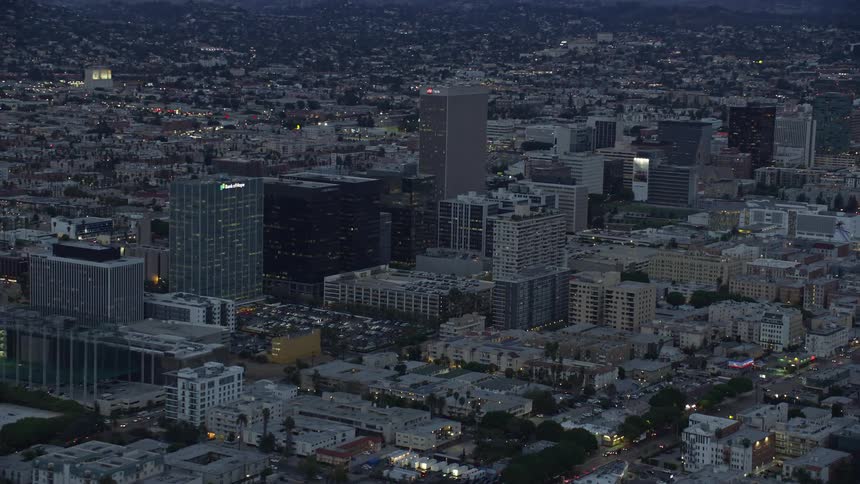 An epic aerial shot of office buildings in Koreatown during twilight over Los Angeles California
